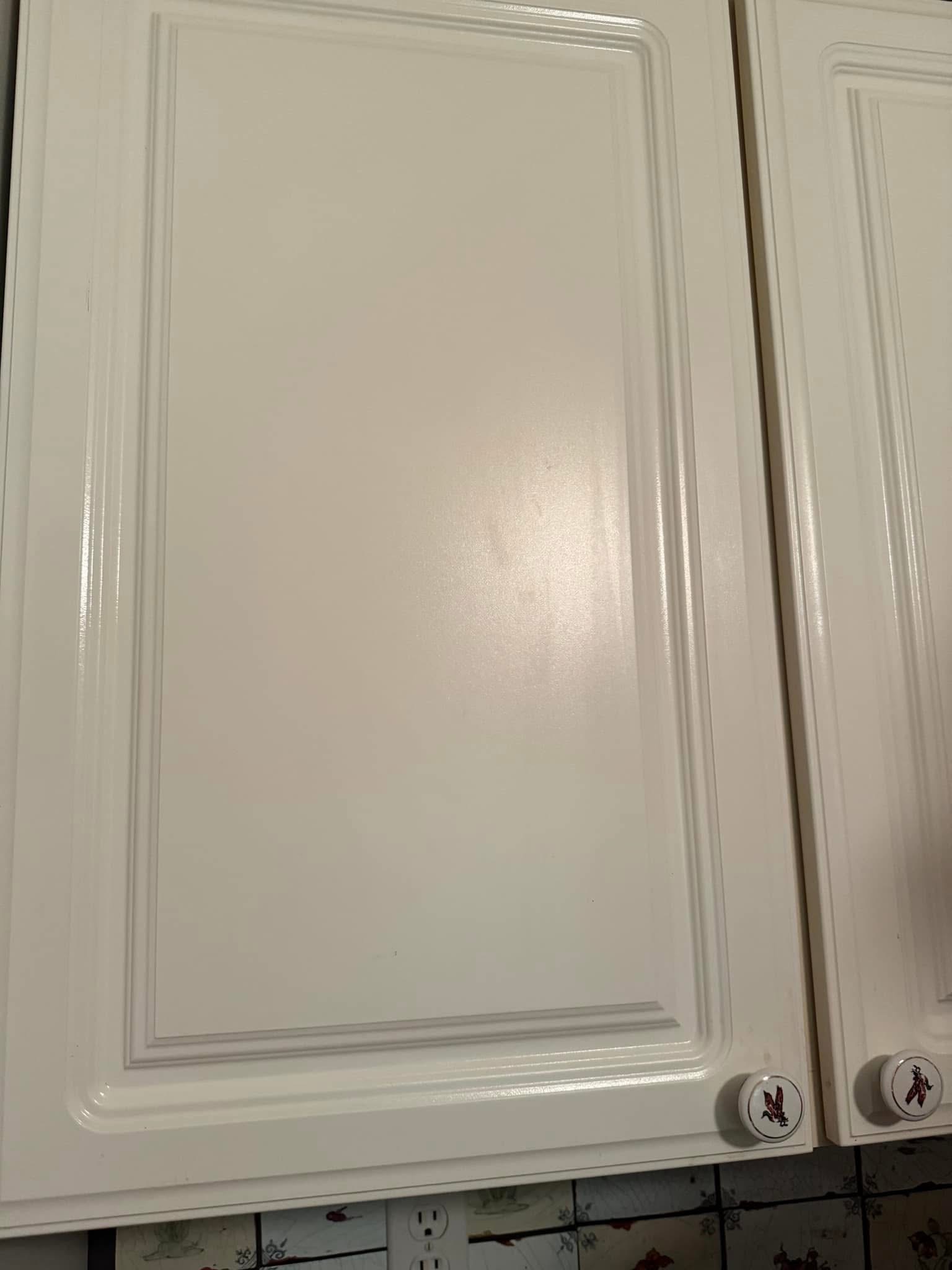 The same white kitchen cabinets clean and polished